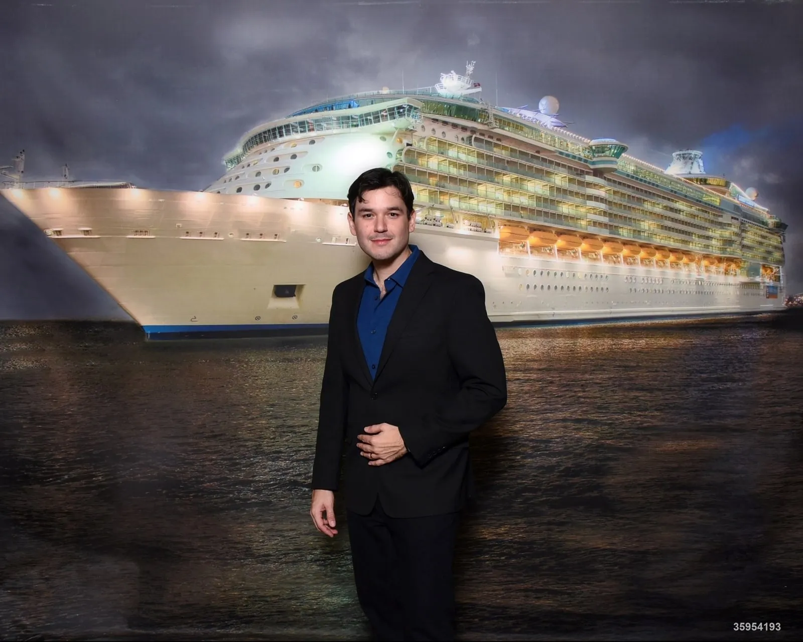 Andrew in front of a cruise ship at night